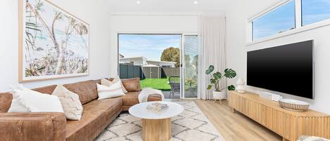 Rear living room opening onto backyard