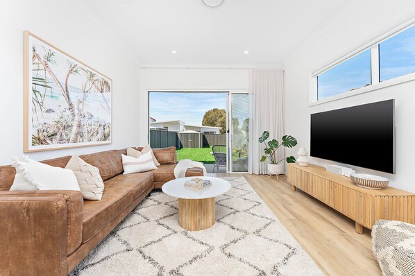 Rear living room opening onto backyard