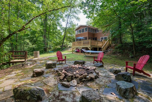 Warm up by the fire pit in our serene backyard