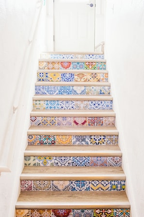 Decorative stairs leading from the entrance to the living room