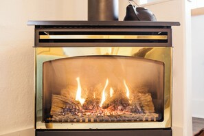 Our gas furnace heats the entire living room, creating warm, cozy atmosphere. 