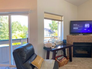 Relax in the living area with a Smart TV and a warm fireplace...and views!