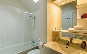 Get ready for the day in the bright bathroom.