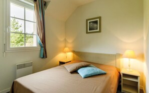 Drift to sleep in this plush bed.