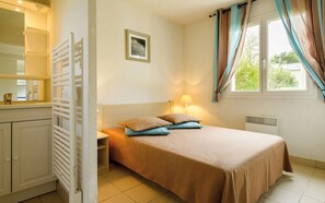 Get a peaceful night sleep in our cozy bedroom.