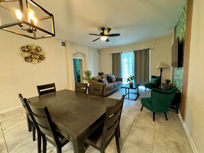 Enjoy family meals in this open dining and living space, designed for comfort and convenience.