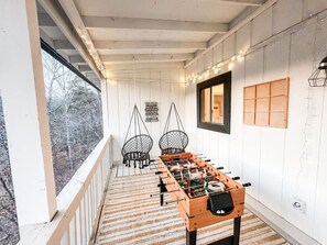 Relax on the peaceful back porch and embrace the beauty of the outdoors.