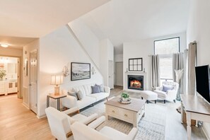 Unwind in the inviting ambiance of this beautiful living room, the perfect gathering spot for friends and family—an ideal feature that embodies everything the Cove Cottage has to offer!