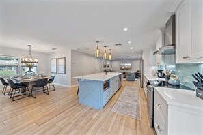 This kitchen is sure to excite the chef in your group! It features an open floor-plan, gorgeous countertops and stainless steel appliances!