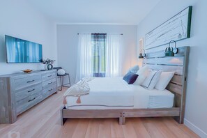 This cozy guest room features a queen-size bed, a 40-inch smart TV,