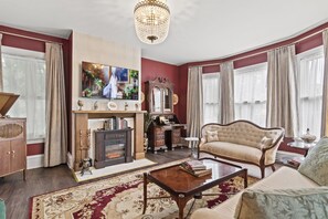 Living Room: Elegant charm with chic decor, plush seating, and a warm fireplace. Perfect for relaxation!