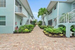 The Everglades Club has a central courtyard with lush gardens
