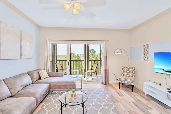 Stylish living area with smart TV and patio access