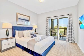 Bright Queen Bedroom Featuring Balcony Access And Elegant Decor