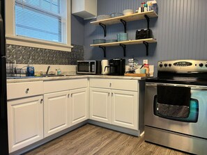 The kitchen invites you to experiment with new recipes, offering a stylish and practical space to cook and create.