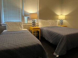 The bedroom’s serene ambiance invites you to relax, with a plush bed that promises a restful night's sleep.