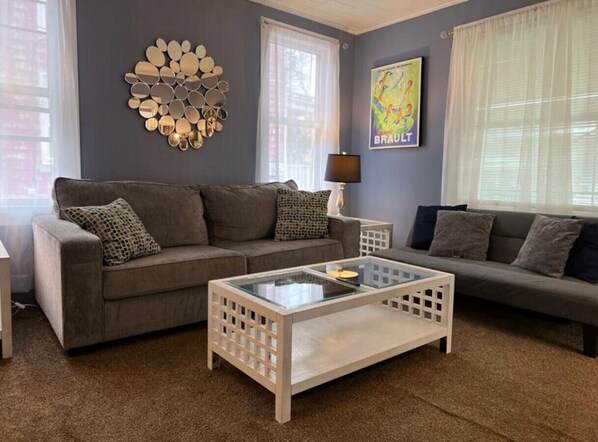 As you take a seat in the living room, the comfortable furniture and tasteful design make it easy to unwind.