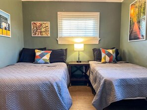 The bedroom’s serene ambiance invites you to relax, with a plush bed that promises a restful night's sleep.