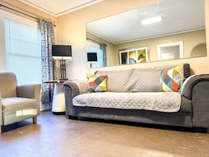 As you take a seat in the living room, the comfortable furniture and tasteful design make it easy to unwind.