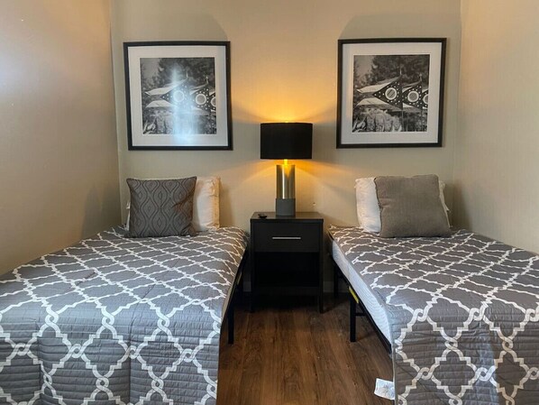 As you settle into the twin beds, you’re surrounded by a calming ambiance that promises a peaceful night’s sleep.
