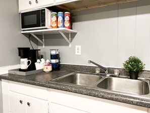You’ll find a well-stocked coffee bar with an array of consumables such as specialty coffees inviting you to enjoy a relaxing beverage at any time.