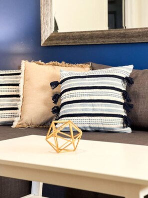 As you take a seat in the living room, the comfortable furniture and tasteful design make it easy to unwind.