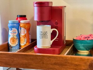 You’ll find a well-stocked coffee bar with an array of consumables such as specialty coffees inviting you to enjoy a relaxing beverage at any time.