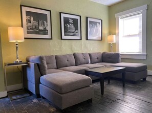 You feel at home as you settle into the living room, where the inviting atmosphere is perfect for lounging or entertaining.