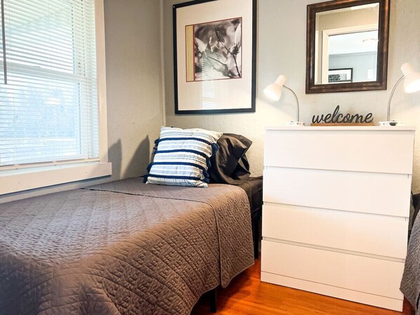 Luxurious twin bedrooms featuring a comfortable bed, elegant decor, and plenty of natural light for a rejuvenating sleep.
