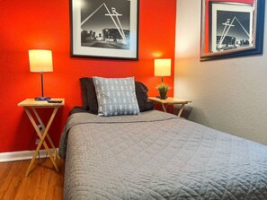 The room’s soft lighting and comfortable twin beds create a serene space perfect for relaxation and restful nights.