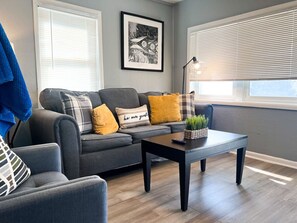 Once you enter the living room you'll find a space that feels both luxurious and cozy, perfect for unwinding after a long day.