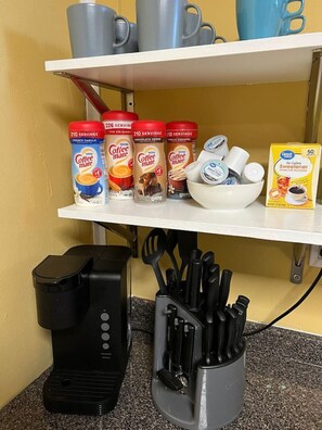 You’ll find a well-stocked coffee bar with an array of consumables such as specialty coffees inviting you to enjoy a relaxing beverage at any time.