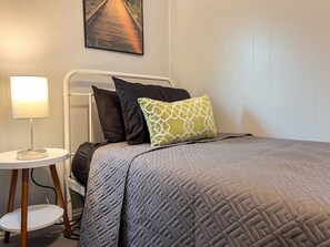 As you enter the bedroom, the comfortable bedding and peaceful atmosphere create the perfect retreat from the day.