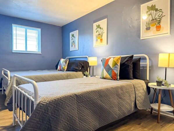 As you settle into the twin beds, you’re surrounded by a calming ambiance that promises a peaceful night’s sleep.