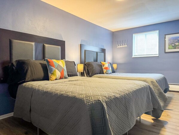 Spacious bedroom with stylish decor, perfect for unwinding after a day of exploring the local area.