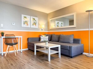 As you take a seat in the living room, the comfortable furniture and tasteful design make it easy to unwind.