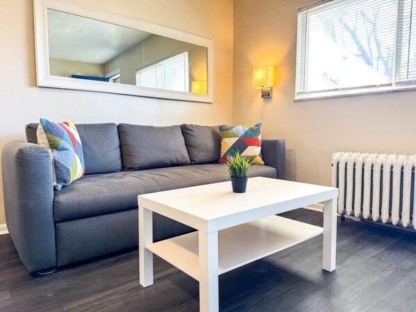 Once you enter the living room you'll find a space that feels both luxurious and cozy, perfect for unwinding after a long day.
