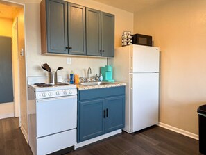 You feel at home as you settle into the living room, where the inviting atmosphere is perfect for lounging or entertaining.
