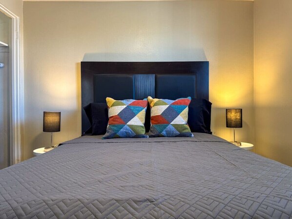Rest comfortably in this spacious bedroom featuring two cozy queen beds, stylish decor, and plenty of natural light. Perfect for families or friends traveling together.