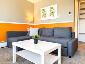As you take a seat in the living room, the comfortable furniture and tasteful design make it easy to unwind.