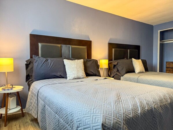 The bedroom offers a luxurious retreat, with a bed that promises restful nights and a room that feels like a private oasis.