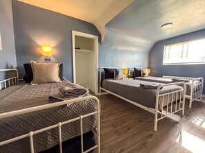 Nestled between soft pillows and crisp linens, the twin beds provide a welcoming retreat after a day of adventure.