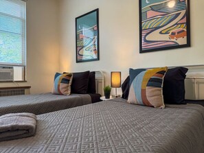 As you settle into the twin beds, you’re surrounded by a calming ambiance that promises a peaceful night’s sleep.