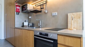 Compact and fully equipped kitchenette, featuring modern appliances and all the essentials for preparing meals #convenient #enjoy