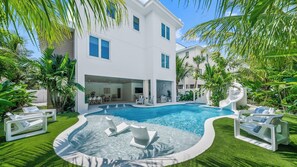 Resort Style Pool - Tropical Landscaping - and Sunshelf