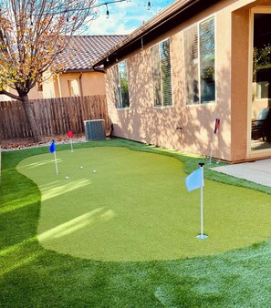 Enjoy hours of entertainment with putting green featuring three holes mini golf