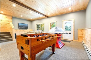 Gather around for friendly competition on the foosball table.