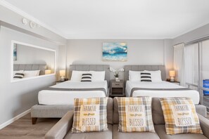 Your condo has 2 queen-size beds, a bedside table and nightstands, a regular sectional sofa, and a wall mirror.