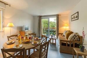 Loads of room at the dining table and the open concept is always nice for the cook.