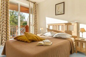 Relax on the luxurious bed after a day outside.